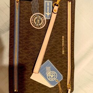Brand new, limited edition,rare/collective authentic Michael Kors travel pouch.